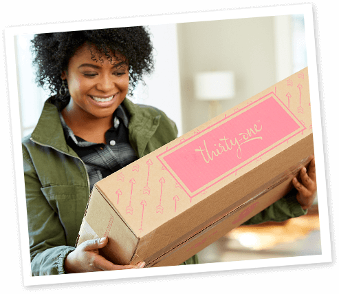 a women opening a box of products